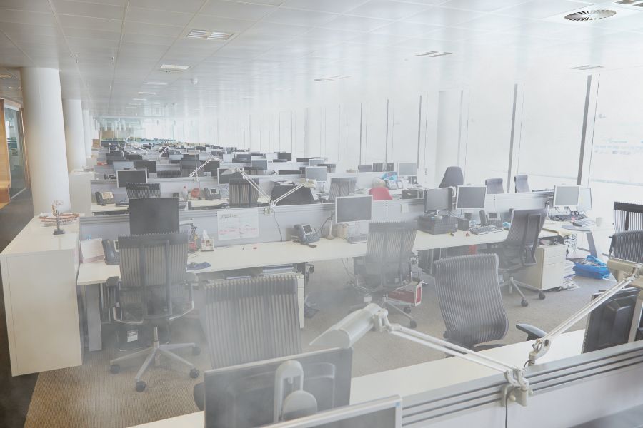 An empty office filled with fog, from a ULV fogging disinfection clean