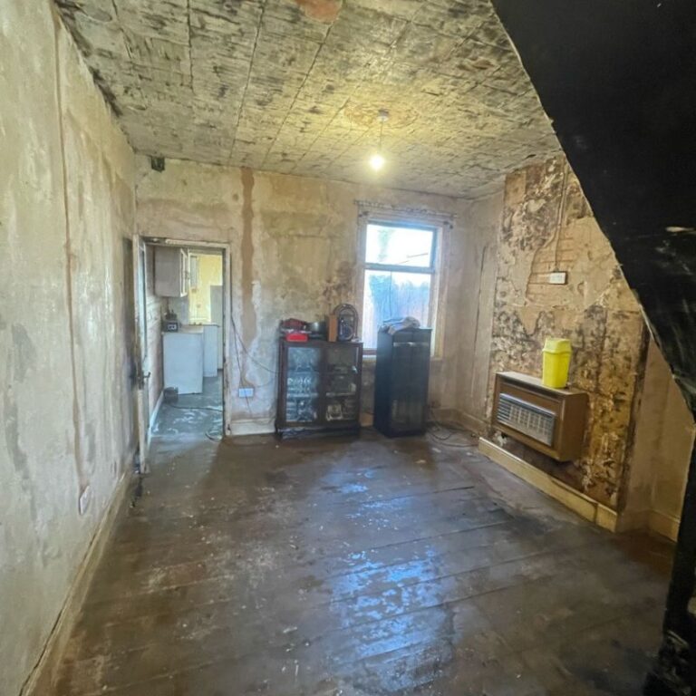 An empty living room that has been professionally cleaned after a fire