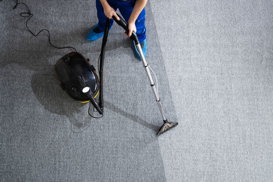 A professional carpet cleaning in the West Midlands, cleaning an office carpet