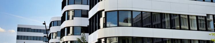 the side of a building that has been professionally building facade cleaned