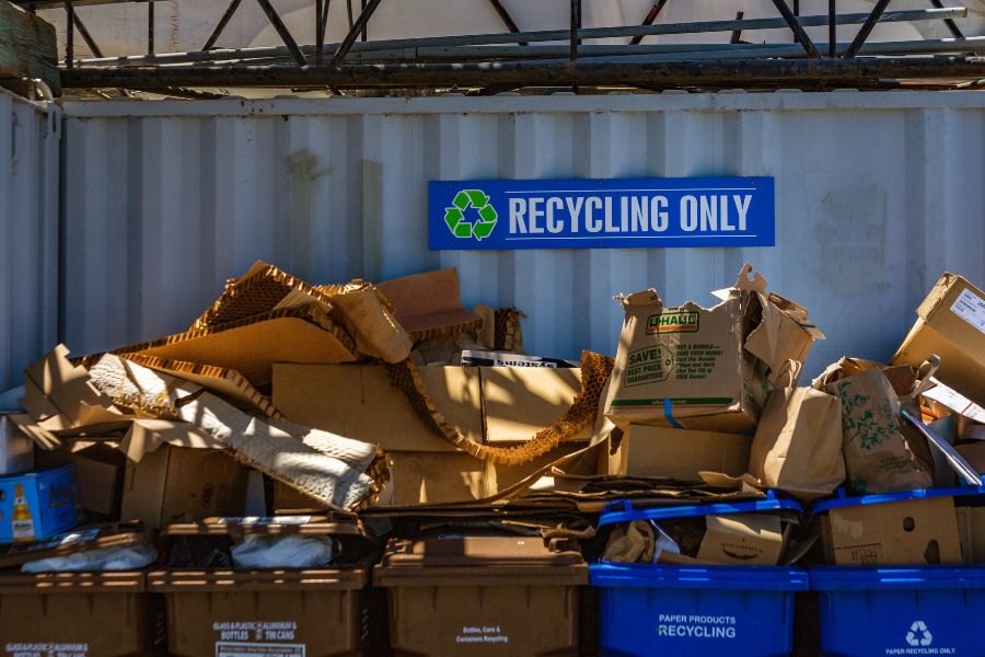 industrial bin stores ready to be cleaned saying recycling only