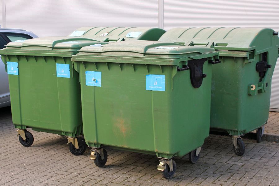 green industrial bin stores ready to be cleaned