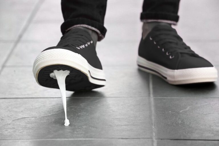 a close up of a shoe that's trodded in chewing gum