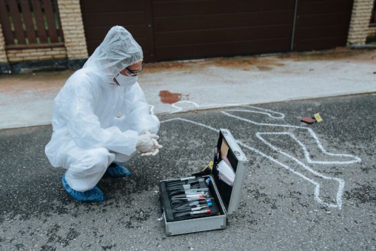 a picture of a crime scene cleaner in a PPE
