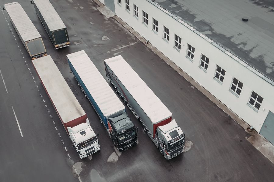 a birdeye view of a fleet of coaches parking