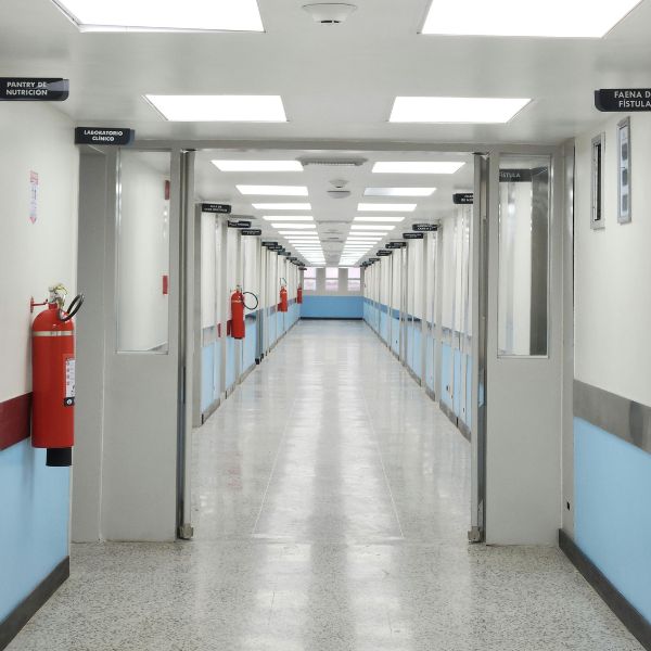 Clean hospital corridor within a healthcare and medical facility maintained to hygiene standards